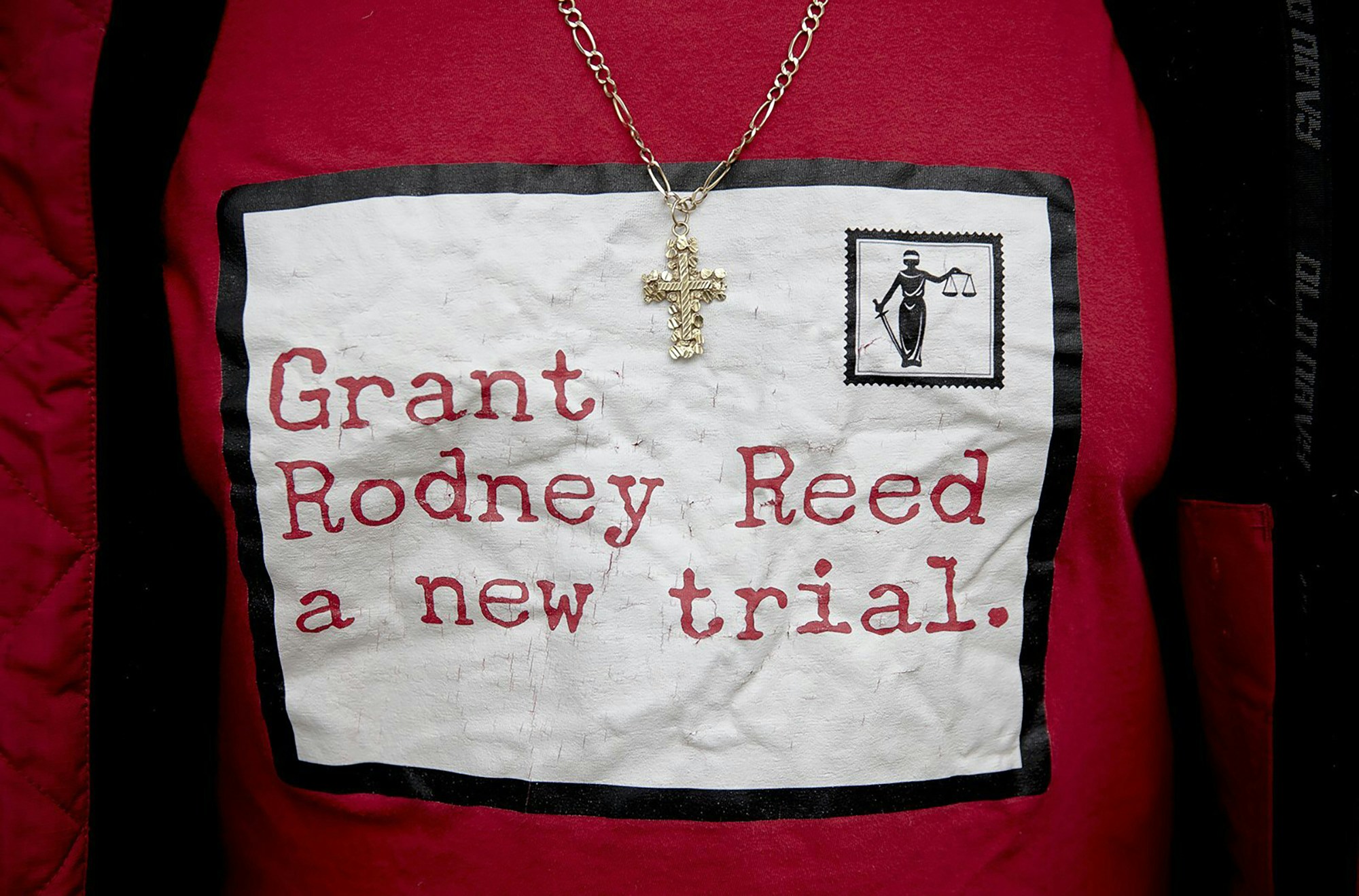 A man wears a shirt in support of Rodney Reed during a protest against Reed's execution on Wednesday, Nov. 13, 2019, in Bastrop, Texas. Protesters rallied in support of Reed’s campaign to stop his scheduled Nov. 20 execution for the 1996 killing of a 19-year-old Stacy Stites. New evidence in the case has led a growing number of Texas legislators, religious leaders and celebrities to press Gov. Greg Abbott to intervene. (Nick Wagner/Austin American-Statesman via AP)