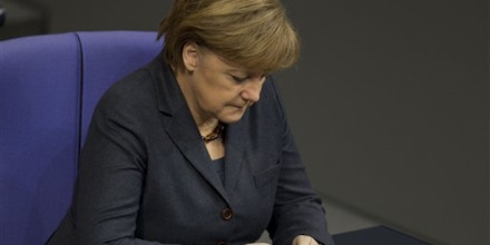 German Chancellor Angela Merkel uses her mobile phone in Berlin in 2011. (AP File Photo/Gero Breloer)
