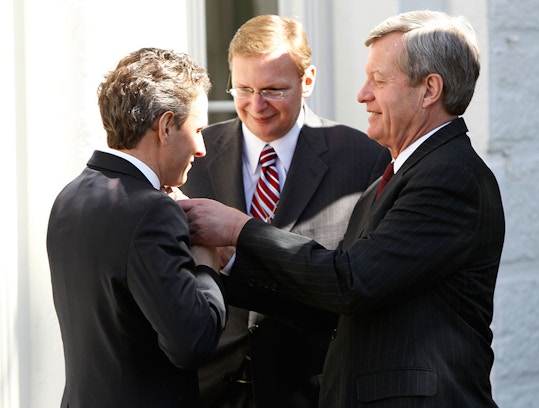 Sen. Max Baucus, D-Mont., adjusts Treasury Secretary Tim Geithner's tie as White House Deputy Chief of Staff Jim Messina looks on after President Barack Obama signed the HIRE Act jobs bill in the Rose Garden of the White House in Washington, Thursday, March 18, 2010. (AP Photo/Charles Dharapak)