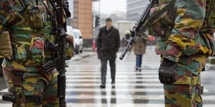Belgian soldiers patrol in front of EU headquarters in Brussels on Monday, Jan. 19, 2015. Security has been stepped up after thirteen people were detained in Belgium in an anti-terror sweep following a firefight in Verviers, in which two suspected terrorists were killed. (AP Photo/Virginia Mayo)