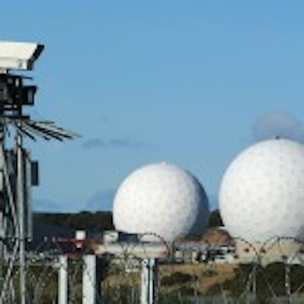 HARROGATE, UNITED KINGDOM - OCTOBER 30:  A security camera overlooks the radar domes of RAF Menwith Hill in north Yorkshire dominate the skyline on 30 October, 2007, Harrogate, England. The base is reported to be the biggest spy base in the world. Britain recently agreed to a United States request for the RAF Menwith Hill monitoring station, also known as the 13th field station of the US national security agency. in North Yorkshire to be used as part of its missile defence system, Dubbed 'Star War Bases' by anti-war and CND campaigners. The base houses British and United States personnel.  (Photo by Christopher Furlong/Getty Images)