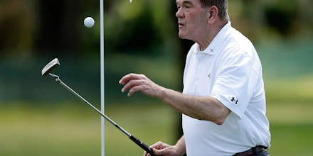 Former U.S. Secretary of Homeland Security and former Pennsylvania Gov., Tom Ridge, flips the ball to himself during a pro-am before the start of the Arnold Palmer Invitational golf tournament at Bay Hill Wednesday, March 19, 2014, in Orlando, Fla. Ridge was also a member of the U.S. House of Representatives. (AP Photo/Chris O'Meara)