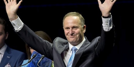 New Zealand Prime Minister John Key waves as he makes a speech after winning the national election in Auckland, New Zealand, Saturday, Sept. 20, 2014. Key won an emphatic victory in New Zealand's general election to return for a third term in office, a result that will be seen as an endorsement of the way Key's National Party has handled the economy. (AP Photo/New Zealand Herald, Mark Mitchell) NEW ZEALAND OUT, AUSTRALIA OUT