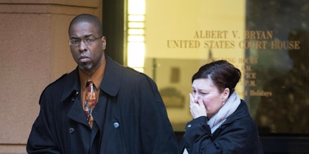 Former CIA officer Jeffrey Sterling leaves the Alexandria Federal Courthouse, Monday, Jan. 26, 2015, in Alexandria, Va., with his wife, Holly, after being convicted on all nine counts he faced of leaking classified details of an operation to thwart Iran's nuclear ambitions to a New York Times reporter. (AP Photo/Kevin Wolf)