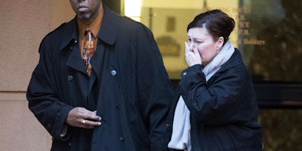 Former CIA officer Jeffrey Sterling leaves the Alexandria Federal Courthouse, Monday, Jan. 26, 2015, in Alexandria, Va., with his wife, Holly, after being convicted on all nine counts he faced of leaking classified details of an operation to thwart Iran's nuclear ambitions to a New York Times reporter. (AP Photo/Kevin Wolf)