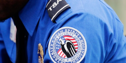 A TSA shoulder patch is shown on the uniform of a Transportation  Security Administration officer at John F. Kennedy International Airport, Thursday, Oct. 30, 2014 in New York. (AP Photo/Mark Lennihan)