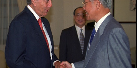 Former U.S. senator and presidential candidate Bob Dole, left, shakes hands with Taiwanese President Lee Teng-hui during a visit to the presidential  office in Taipei on Sunday, July 20, 1997. Lee told Dole, who is on a private visit, that Taiwan's reunification with China can't be handled like Hong Kong, which reverted from British to Chinese rule on July 1. (AP Photo/Kuo Ji Hsiao)