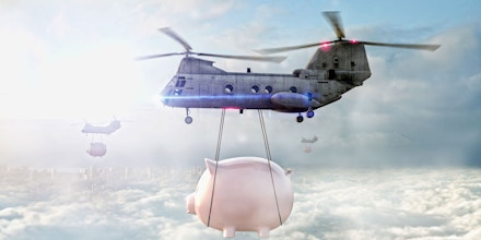 Helicopters carrying piggy banks over clouds