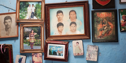 Forty-three male students from the Raul Burgos Rural Teachers College in Ayotzinapa, Guerrero were disappeared on September 26, 2014 at the hands of local police working in conjunction with drug traffickers. Family photos hang on the livivng room wall in the house of Jhosivani Guerrero de la Cruz, one of the 43 missing normal school students, in Omeapa, Guerrero. (Keith Dannemiller)