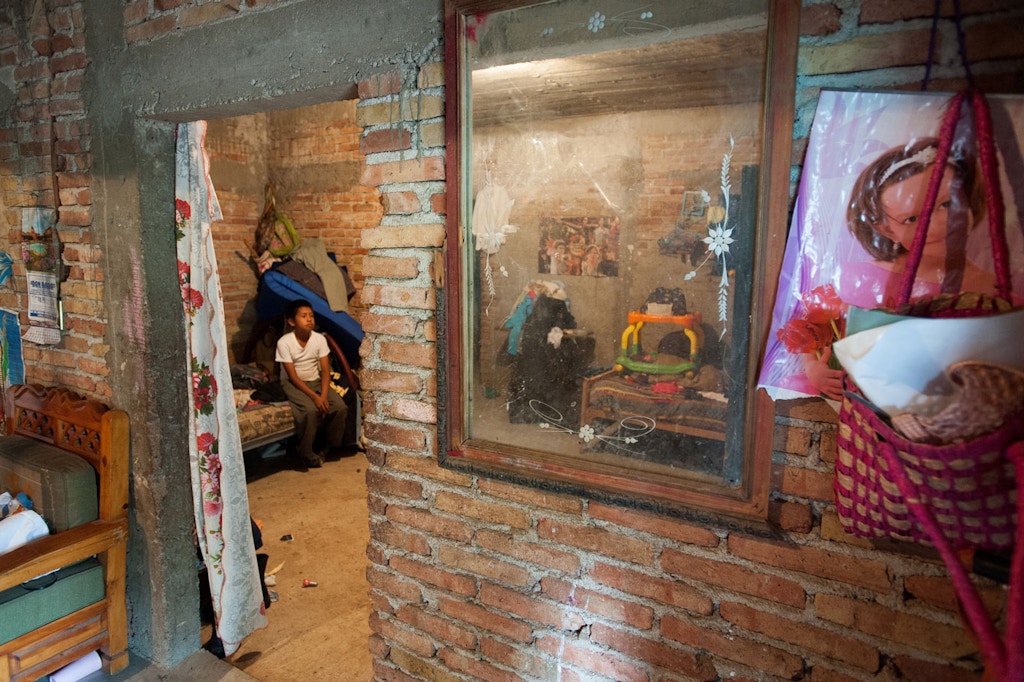 Forty-three male students from the Raul Burgos Rural Teachers College in Ayotzinapa, Guerrero were disappeared on September 26, 2014 at the hands of local police working in conjunction with members of a criminal gang. Views of the interior of the home of Emiliano Alan Gaspar de la Cruz in Omeapa, Guerrero. His younger brother Brian Gaspar de la Cruz sits on a bed tha Emiliano slept in when he was sick and needed the care of his parents.