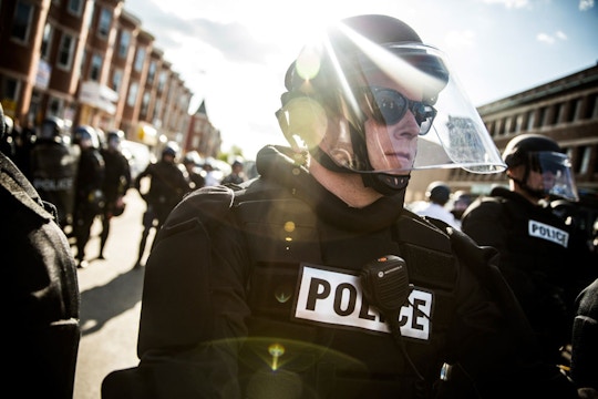 BALTIMORE, MD - APRIL 28:  Police officers stand watch near a CVS pharmacy that was burned to the ground yesterday during rioting after the funeral of Freddie Gray, on April 28, 2015 in Baltimore, Maryland. Gray, 25, was arrested for possessing a switch blade knife April 12 outside the Gilmor Houses housing project on Baltimore's west side. According to his attorney, Gray died a week later in the hospital from a severe spinal cord injury he received while in police custody.  (Photo by Andrew Burton/Getty Images)