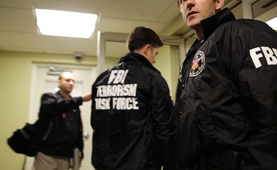 FBI Agents and members of the FBI Terrorism Task Force prepare for a pre-dawn raid on the home of a suspected terrorist.  Pittsburgh, Pennsylvania, 2012.