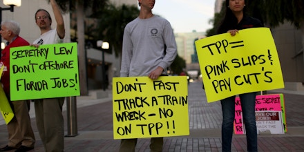 MIAMI, FL - MARCH 20:  Union members and community activists protest outside the Miami Dade College where the Greater Miami Chamber of Commerce and the college were hosting a moderated conversation with U.S. Secretary of the Treasury Jacob Lew on March 20, 2015 in Miami, Florida. The protesters are against the Trans-Pacific Partnership (TPP) which is a proposed twelve-nation pact and are asking the Federal Government and Florida Congressional delegation to reject fast tracking the TPP and warn that the deal poses serious risk to jobs and wages, the environment, food safety and public health for Floridas working families.  (Photo by Joe Raedle/Getty Images)