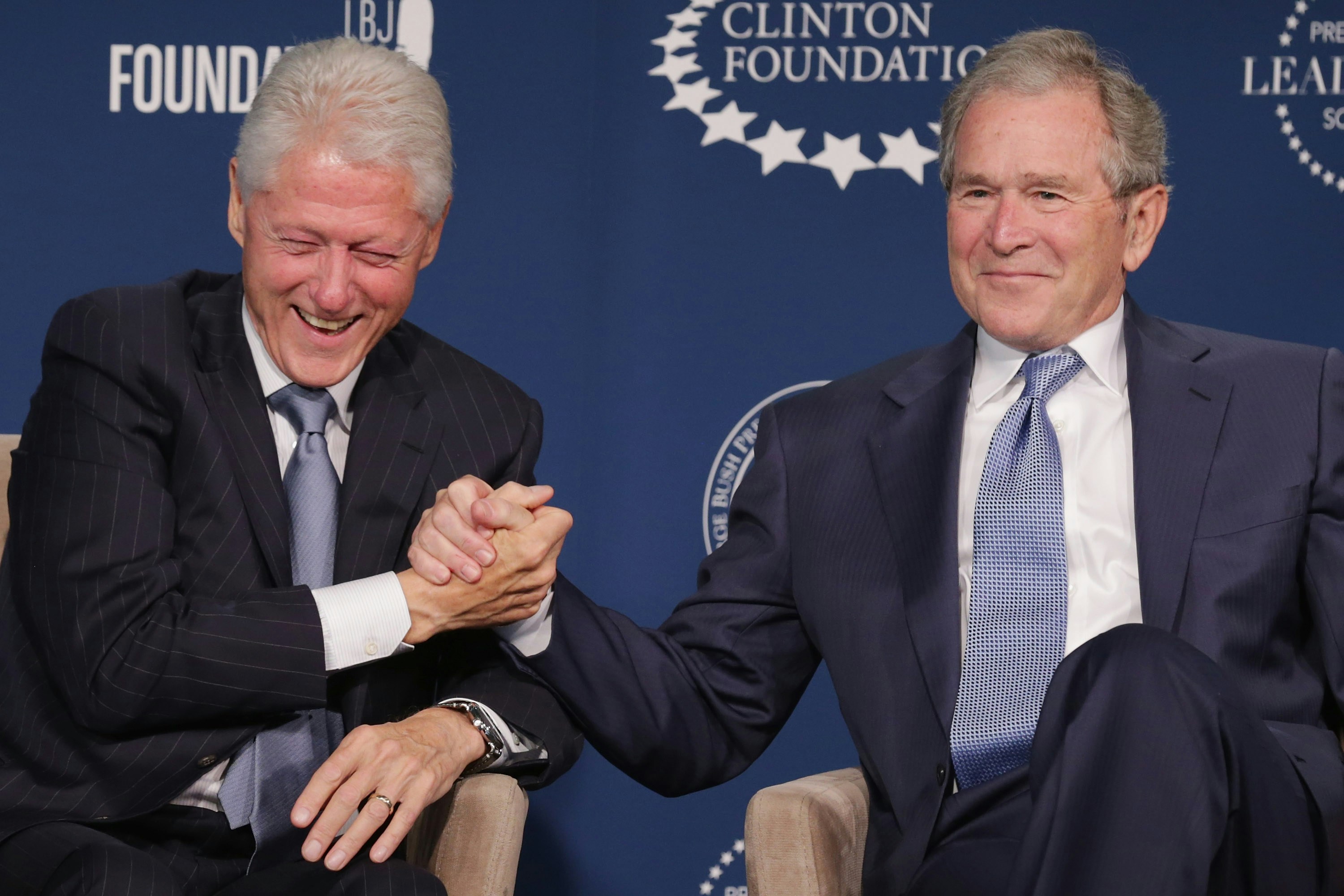 WASHINGTON, DC - SEPTEMBER 08:  Former U.S. presidents Bill Clinton (L) and George W. Bush talk about their hopes for the Presidential Leadership Scholars program at the Newseum September 8, 2014 in Washington, DC.With the cooperation of the Clinton, Bush, Lyndon B. Johnson and George H. W. Bush presidential libraries and foundations, the new scholarship program will provide 'motivated leaders across all sectors an opportunity to study presidential leadership and decision making and learn from key administration officials, practitioners and leading academics.'  (Photo by Chip Somodevilla/Getty Images)