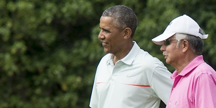 US President Barack Obama chats with Malaysian Prime Minister Najib Razzak as they play golf at Marine Corps Base Hawaii on December 24, 2014.   AFP PHOTO/Nicholas KAMM        (Photo credit should read NICHOLAS KAMM/AFP/Getty Images)