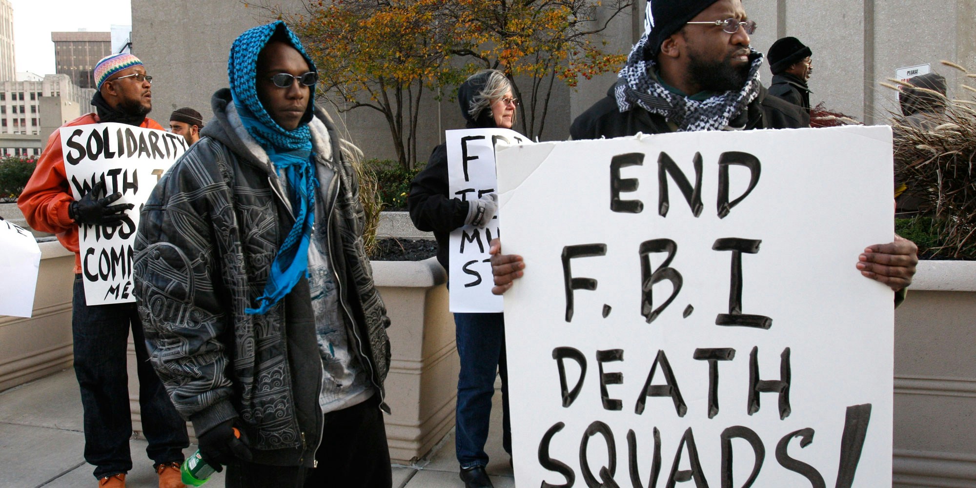 Akil Fahd, right, protests with others outside the McNamara Federal Building in Detroit, Thursday, Nov. 5, 2009. The protesters want an independent investigation into the death of Luqman Ameen Abdullah, a Detroit imam killed in a shootout with federal agents.   (AP Photo/Carlos Osorio)
