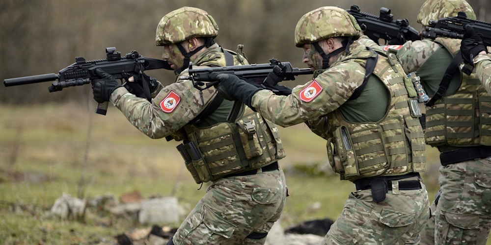 Special Police Units of the Republika Srpska participate in a tactical demonstration at the training center Manjaca near western Bosnian town of Banja Luka, 260 kms west of Sarajevo , Bosnia, on  Wednesday, March 25, 2015. Ten soldiers from U.S. Special Operations Command Europe, 18 police officers from the Police Forces of  the Federation of Bosnia Herzegovina and 18 from the Police Forces of  the Republic of Srpska trained and lived together for a month and conclude their training with this exercise. The month-long Joint Combined Exchange Training (JCET) program provides U.S. Special Operations Forces a chance to train with colleagues in partner nations to develop their military tactics and skills in unfamiliar settings, while also improving bilateral relations and interoperability with partner nation forces. (AP Photo/Radivoje Pavicic)