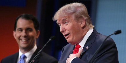 CLEVELAND, OH - AUGUST 06:  Republican presidential candidates Donald Trump (R) and Wisconsin Gov. Scott Walker participate in the first prime-time presidential debate hosted by FOX News and Facebook at the Quicken Loans Arena August 6, 2015 in Cleveland, Ohio. The top-ten GOP candidates were selected to participate in the debate based on their rank in an average of the five most recent national political polls.  (Photo by Chip Somodevilla/Getty Images)