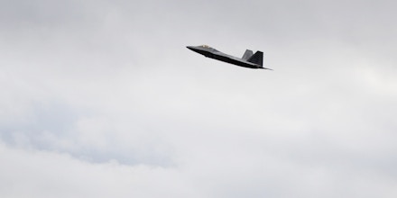 File - In this Sept. 21, 2011 file photo, a pair of F-22 Raptor stealth fighters fly together over Joint Base Elmendorf-Richardson in Anchorage, Alaska. Joint Base Elmendorf-Richardson’s F-22s have been modified to replace the handles that engage the stealth fighter jet’s emergency oxygen system. The move comes after the death of pilot Capt. Jeffrey Haney in November 2010 when his F-22 crashed 100 miles north of Anchorage. Haney’s widow, Anna Haney, has filed a wrongful death lawsuit that claims the plane’s onboard oxygen delivery system is defective. (AP Photo/Michael Dinneen, file)