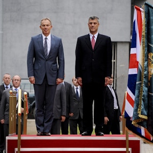 Former British Prime Minister Tony Blair (L) and Kosovo Prime Minister Hashim Thaci (R) review Kosovo's Security Force honour guard, during an official welcoming ceremony in Pristina on July 8, 2010.Blair is considered very highly by Kosovars for his role during the NATO air campaign over the Serbs, an objective which helped end the war in Kosovo. Blair, together with former USA President Bill Clinton, were the main actors that started NATO air strikes over the Serb Military Forces in the spring of 1999, which was crucial for the freedom of Kosovo and the expulsion of Serb police and military from Kosovo. This is the second visit of Tony Blair to Kosovo since the end of the war in 1999. AFP PHOTO/ARMEND NIMANI (Photo credit should read ARMEND NIMANI/AFP/Getty Images)