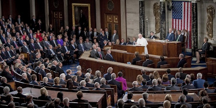 Pope Francis speaks to a joint meeting of Congress in the House Chamber at the U.S. Capitol in Washington, D.C., U.S., on Thursday, Sept. 24, 2015. Pope Francis, the first pontiff to address U.S. Congress, is preaching to a less-than-harmonious congregation as he faces a Congress riven by disputes over issues closest to his heart: income inequality, immigration and climate change. Photographer: Pete Marovich/Bloomberg via Getty Images