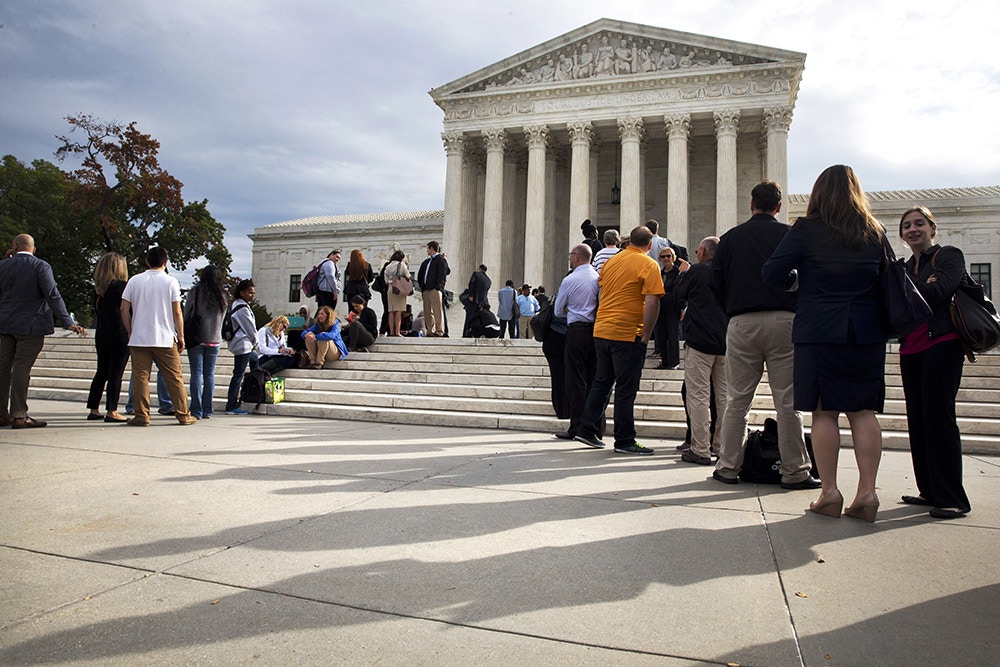 People line up outside of the Supreme Court in Washington, Tuesday, Oct. 13, 2015, as Justices began to discuss sentences for young prison 'lifers.' A decision in Montgomery v. Louisiana, 14-280, is expected by late spring. (AP Photo/Jacquelyn Martin)