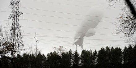 An unmanned Army surveillance blimp floats through the air while dragging a tether line just south of Millville, Pa., Wednesday, Oct. 28, 2015. The bulbous, 240-foot helium-filled blimp came down near Muncy, a small town about 80 miles north of Harrisburg. The North American Aerospace Defense Command in Colorado said the blimp detached from its station at the military's Aberdeen Proving Ground in Maryland.  (Jimmy May/Bloomsburg Press Enterprise via AP)