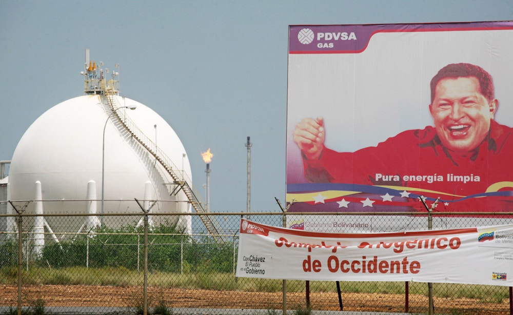 A signs shows Venezuelan President Hugo Chavez at the gas processing plant in the  Complex  Jose in Anzoategui state, 200 miles East from Caracas, Venezuela. The complex, that make refined crude from the heavy oil of the Orinoco Belt, is a joint venture between Venezuelan state owned PDVSA and the foreign companies Chevron, British Petrolum, Total and Statoil. May 1st 2007 Venezuelan President Hugo Chavez changed the stock holding of the complex to make PDVSA ,with 60 percent of the stocks , control the participating companies.Photographer Diego Giudice/Bloomberg News