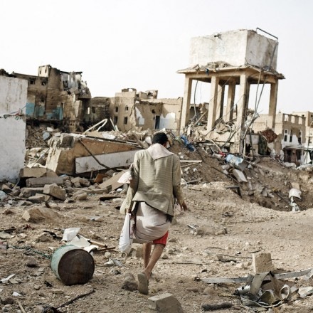 SADAH, YEMEN - JUNE 15:  Civilians walk through the destroyed city of Sadah, Yemen, on June 15, 2015. The Arab coalition has been carrying out air strikes on a daily basis in Sadah, a bastion of Houthi rebels, and warned all civilians to leave the restive province after declaring the entire territory a 