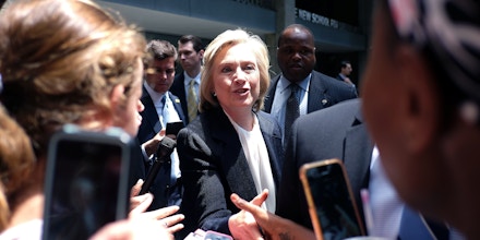 US Democratic presidential hopeful Hillary Clinton (C) greets people on the sidewalk as she leaves the New School after speaking to outline economic vision in New York on July 13, 2015. Clinton promised on July 13, to raise incomes of hardworking Americans and rein in excesses on Wall Street in the first major economic policy address of her 2016 campaign. AFP PHOTO/JEWEL SAMAD        (Photo credit should read JEWEL SAMAD/AFP/Getty Images)