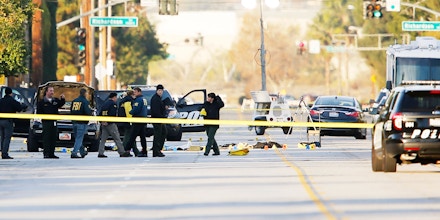 Image #: 41251069    FBI and police investigator are seen around a vehicle in which two suspects were shot following a mass shooting in San Bernardino, California December 3, 2015. Authorities on Thursday were working to determine why Syed Rizwan Farook, 28, and Tashfeen Malik, 27, who had a 6-month-old daughter together, opened fire at a holiday party of his co-workers in Southern California, killing 14 people and wounding 17 in an attack that appeared to have been planned.   REUTERS/Mike Blake /LANDOV