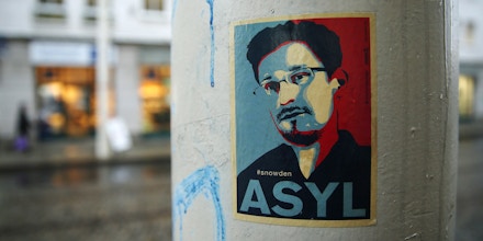 DRESDEN, GERMANY - JANUARY 05:  A sticker demanding asylum for whistleblower and former NSA worker Edward Snowden hangs stuck to a lamppost on January 5, 2015 in Dresden, Germany. Many Germans favour granting Snowden asylum in Germany following reports that the NSA has conducted extensive eavesrodpping operations in Germany and even listened in on the mobile phone of German Chancellor Angela Merkel.  (Photo by Sean Gallup/Getty Images)