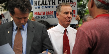 US politician and physician Howard Dean (C) with Senator Sherrod Brown (L) D-OH prepare to address a massive rally titled 