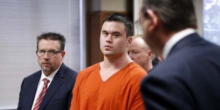 Daniel Holtzclaw, center, listens as Gayland Gieger, right, Oklahoma County assistant district attorney, speaks during Holtzclaw's sentencing hearing in Oklahoma City, Thursday, Jan. 21, 2016. At left is defense attorney Scott Adams. (AP Photo/Sue Ogrocki, Pool)