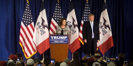 Sarah Palin, former governor of Alaska, left, and Donald Trump, president and chief executive of Trump Organization Inc. and 2016 Republican presidential candidate, listen to a question from the audience during a campaign rally at the Hansen Agricultural Student Learning Center at Iowa State University in Ames, Iowa, U.S., on Tuesday, Jan. 19, 2016. Trump's campaign to win the Iowa caucuses in less than two weeks received a boost from a Tea Party favorite, Sarah Palin. Photographer: Cassi Alexandra/Bloomberg via Getty Images
