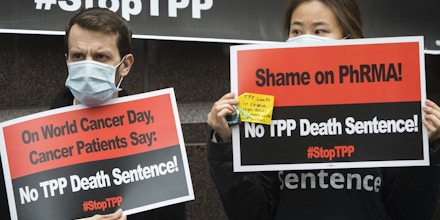 Cancer patients and survivors, health professionals and others protest the Trans-Pacific Partnership (TPP) trade deal outside of PhRMA, the Pharmaceutical Research and Manufacturers of America, in Washington, DC, February 4, 2016.Cancer patients and survivors, health professionals and others demonstrated outside the trade group's offices against the TPP, which they say will prevent access to life-saving generic medicines and increase drug costs. / AFP / Saul Loeb (Photo credit should read SAUL LOEB/AFP/Getty Images)