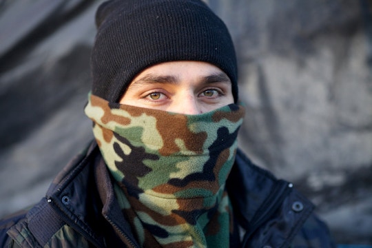 Mohamed Salim, a former Afghan Special Forces soldier, is seen in the refugee camp known as "The Jungle" in Calais, France, 04 December 2015. Conditions are deteriorating rapidly in the camp of an estimated 6,000 people as winter approaches, increasing the desperate attempts to break though fences and stowaway on trucks or trains, attempts that have seen 18 refugees die since June 2015. (John D McHugh/Verifeye Media)
