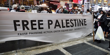 Palestinian and Jewish groups supporting the Palestinian cause stage a rally walking from Times Square to United Nations Building in New York  Thursday, Sept. 15, 2011. The marchers are calling to end all U.S. Aid to Israel, end the Occupation and support Boycott, Divestment, Sanctions against Israel (AP Photo/David Karp)