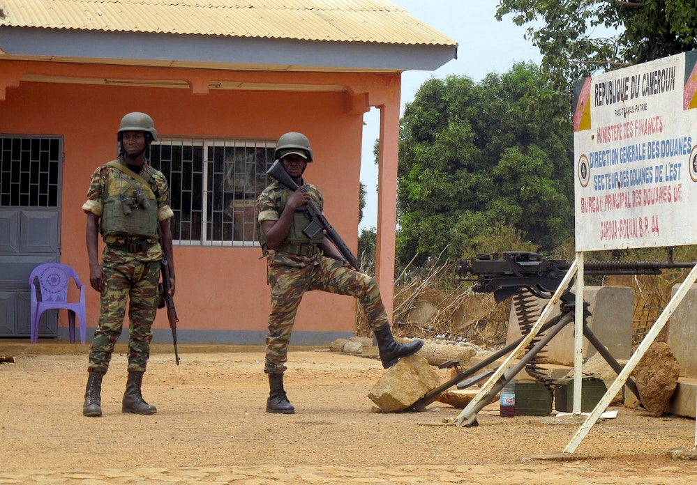 Cameroonian soldiers standing guard at the frontier post of Garoua-Boulai, March 13, 2014.