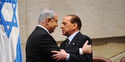 JERUSALEM, ISRAEL - FEBRUARY 3: (ISRAEL OUT) In this handout photo provided by the Israeli Government Press Office (GPO), Italian Prime Minister Silvio Berlusconi (R) greets Israeli Prime Minister Benjamin Netanyahu at the Knesset on February 3, 2010 in Jerusalem, Israel.