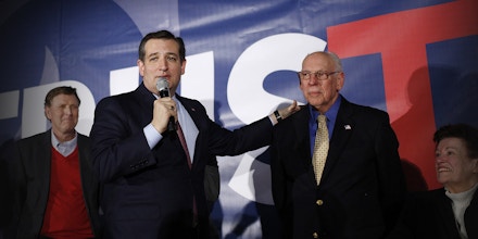 Senator Ted Cruz, a Republican from Texas and 2016 presidential candidate, center, stands next to his father Rafael Cruz, second right, as his wife Heidi Cruz, left, applauds during his campaign's caucus night celebration at the Elwell Center on the Iowa State Fairgrounds in Des Moines, Iowa, U.S., on Monday, Feb. 1, 2016. Cruz won the Iowa Republican caucuses in an upset over billionaire Donald Trump, while Democrat Hillary Clinton was clinging to the narrowest edge over Senator Bernie Sanders of Vermont. Photographer: Luke Sharrett/Bloomberg via Getty Images