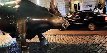 NEW YORK, NY - JUNE 04:  The iconic Wall Street bull is viewed in the early hours of the morning on June 4, 2015 in New York City. Following the deaths of a number of young workers in the finance industry, the 24 hour work culture of many top banks is coming under increased scrutiny. London, New York and San Francisco are just a few of the cities where young employees in the financial sector have recently died in circumstances thought to be related to high stress and a lack of sleep. It is not in common for new employees in banking and finance to go days with little sleep or down time.  (Photo by Spencer Platt/Getty Images)