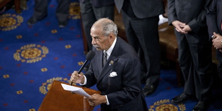 Rep. John Conyers, D-MI, administers an oath during a swearing-in ceremony in the House of Representatives as the 114th Congress convenes on Capitol Hill January 6, 2015 in Washington, DC. Republican John Boehner was re-elected and sworn in Tuesday as speaker of the US House of Representatives, overcoming a surprisingly robust attempt to oust him by two dozen hardcore conservatives. Boehner received 216 of the 408 votes cast in the chamber, winning as expected over Democrat leader and former House speaker Nancy Pelosi, who received 164 votes.  AFP PHOTO/BRENDAN SMIALOWSKI        (Photo credit should read BRENDAN SMIALOWSKI/AFP/Getty Images)