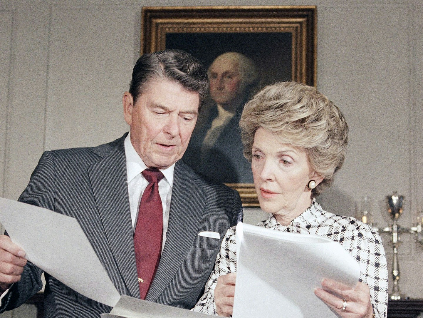 President Ronald Reagan and Mrs. Nancy Reagan go over their joint address which they will give to the nation, at the White House in Washington on Sept. 13, 1986. The address, which will be seen nationally on Sunday, will focus on the war against drug abuse. (AP Photo/Charles Tasnadi)