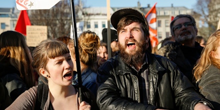 People gather to demonstrate against Iceland's prime minister, in Reykjavik on Monday April 4, 2016. Iceland's prime minister insisted Monday he would not resign after documents leaked in a media investigation allegedly link him to an offshore company that could represent a serious conflict of interest, according to information leaked from a Panamanian law firm at the center of an international tax evasion scheme. (AP Photo/Brynjar Gunnarsson)