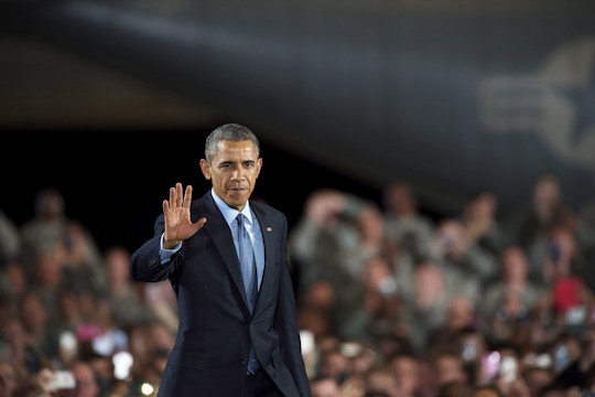 JOINT BASE MCGUIRE-DIX-LAKEHURST, NEW JERSEY - DECEMBER 15:  U.S. President Barack Obama waves as he takes the stage to address an audience of armed forces December 15, 2014 at Joint Base McGuire-Dix-Lakehurst, New Jersey. Obama will address the troops to thank them for their service and mark the end of the combat mission in Afghanistan. ahead of the upcoming holidays.  (Photo by Mark Makela/Getty Images)