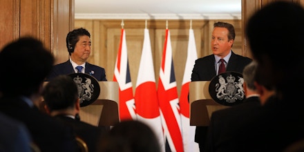 British Prime Minister David Cameron (R) and Japanese Prime Minister Shinzo Abe attend a joint press conference following their meeting inside 10 Downing Street in central London on May 5, 2016.Prime Minister Shinzo Abe warned that Britain would become 