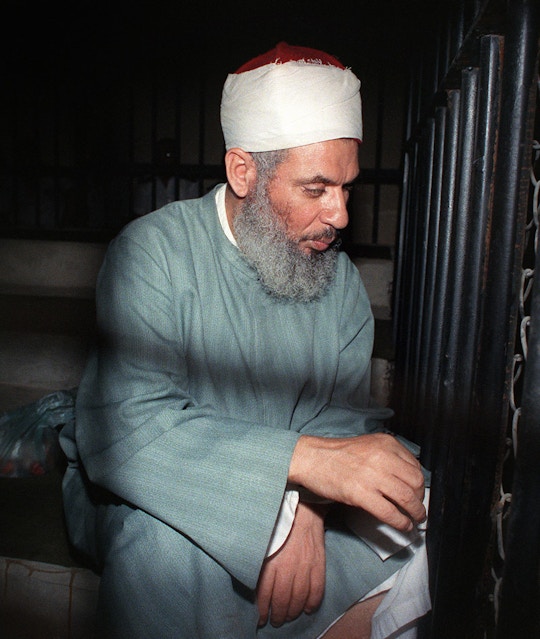 Blind Sheikh Omar Abdel Rahman sits and prays inside an iron cage at the opening of court session, 06 August 1989 in Cairo. Abdel-Rahman, spiritual leader of Egypt's main armed group the Moslem fundamentalist Jamaa Islamiyya, was jailed for life in January 1996 for his role in terrorist attacks, including blowing up the World Trade Center in New York in February 1993 and an assassination bid against Egyptian President Mubarak.        (Photo credit should read MIKE NELSON/AFP/GettyImages)