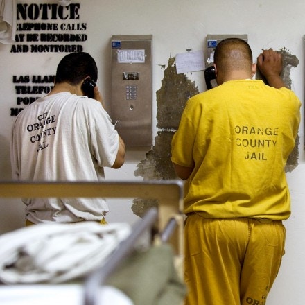 May 24, 2011 - Santa Ana, California, U.S. - Inmates make collect phone calls which could be monitored and recorded at the Sheriff's Central Men's Jail Tuesday. Local officials expect the county jails to fill as inmates remain in county facilities longer following California's release of prisoners from state facilities. ....///ADDITIONAL INFO:   H. LORREN AU JR., THE ORANGE COUNTY REGISTER.   - 5/24/11 - s.prisonrelease.0524.ots -  Photographed in the Intake Release Center and Men's Central Jail in Santa Ana.   A 1 million contract the county has entered in with ICE could also be in question. (Credit Image: © H. Lorren Au Jr/The Orange County Register/ZUMAPRESS.com)