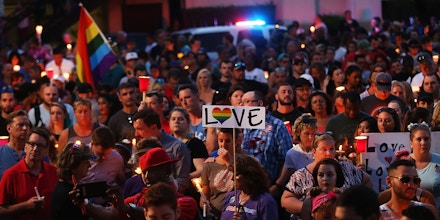 ORLANDO, FL - JUNE 19: People attend a memorial service on June 19, 2016 in Orlando, Florida. Thousands of people are expected at the evening event which will feature entertainers, speakers and a candle vigil at sunset. In what is being called the worst mass shooting in American history, Omar Mir Seddique Mateen killed 49 people at the popular gay nightclub early last Sunday. Fifty-three people were wounded in the attack which authorities and community leaders are still trying to come to terms with. (Photo by Spencer Platt/Getty Images)